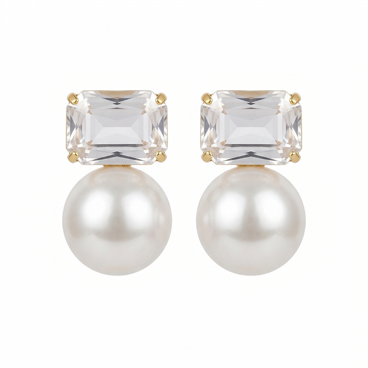 Pair of earrings with clear gemstones and pearls on a white background