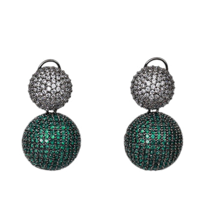 Pair of earrings with green and black gemstones on a white background