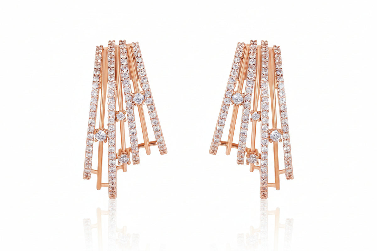 Gold and diamond earrings on a white background