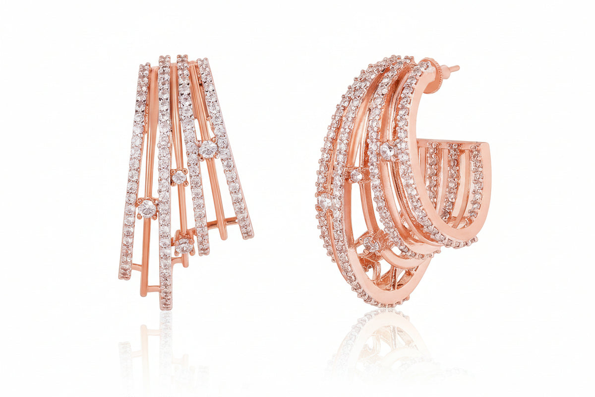 Gold hoop earrings with diamond accents on a white background