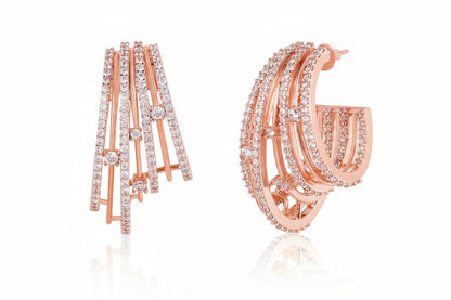 Gold hoop earrings with diamond accents on a white background