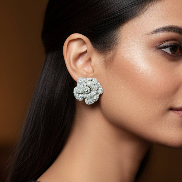 Pair of diamond earrings on a white background