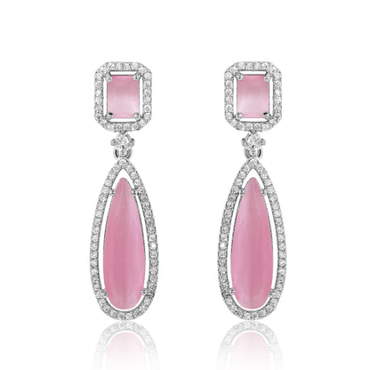 Pair of pink teardrop earrings with silver accents on a white background