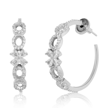 Silver hoop earrings with clear gemstones on a white background
