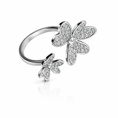 Silver ring with butterfly designs on a white background