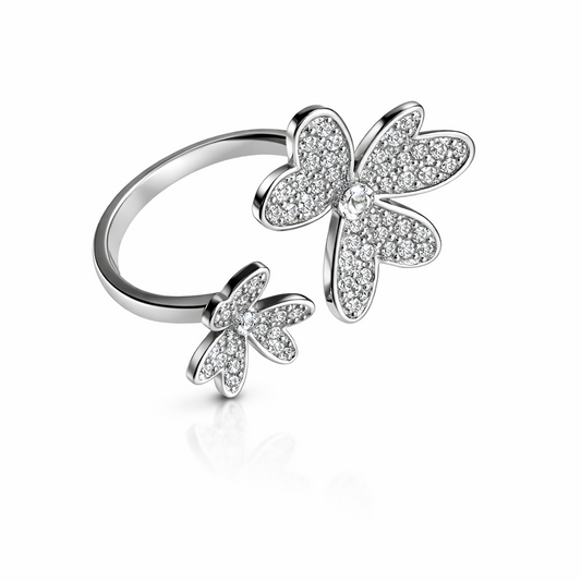 Silver ring with butterfly designs on a white background