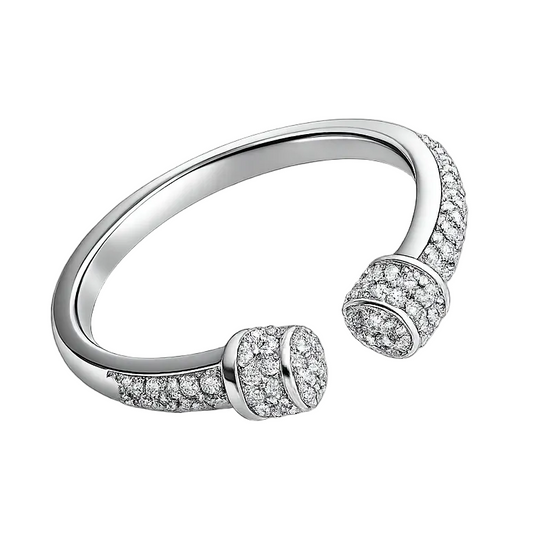 Silver ring with embedded stones on a white background