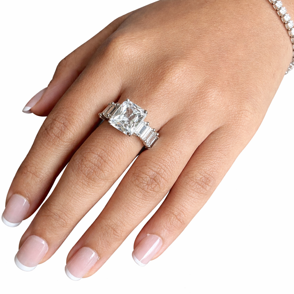 Diamond ring on a hand with a white background