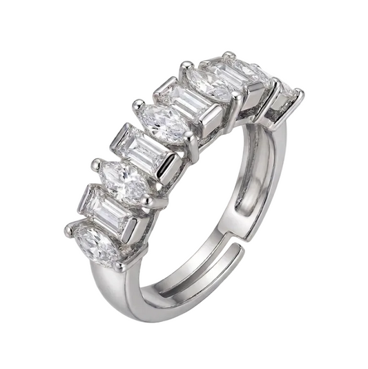 Silver ring with baguette-cut diamonds on a white background