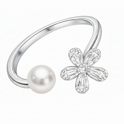 Silver ring with a pearl and flower-shaped diamond on a white background
