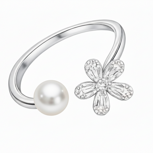 Silver ring with a pearl and flower-shaped diamond on a white background