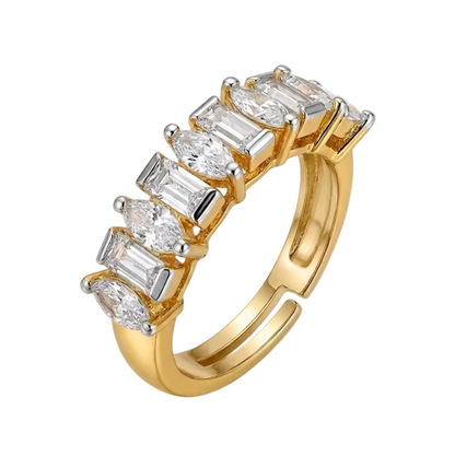 Gold ring with baguette-cut diamonds on a white background