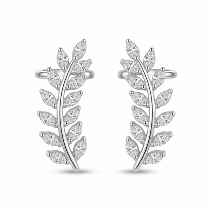 Pair of silver leaf-shaped earrings on a white background