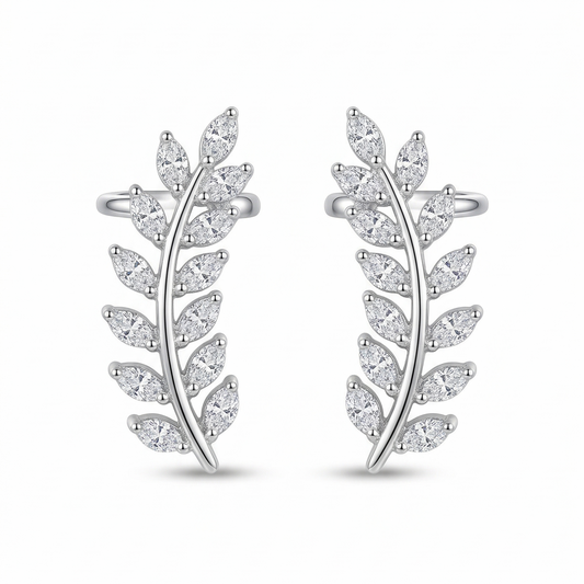 Pair of silver leaf-shaped earrings on a white background