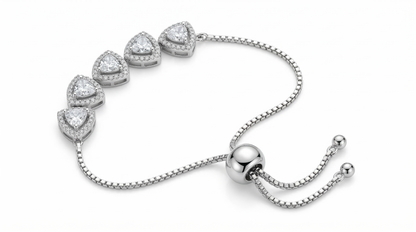 Silver bracelet with heart-shaped diamond charms on a white background