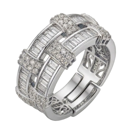 Silver ring with intricate design on a white background