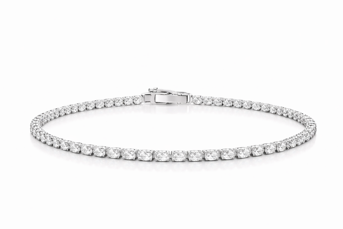 Silver bracelet with clear stones on a white background