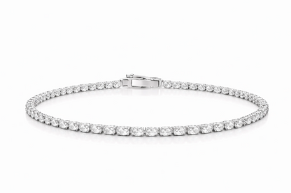 Silver bracelet with clear stones on a white background