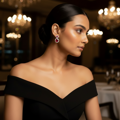 Woman in a black off-shoulder dress in a dimly lit restaurant setting